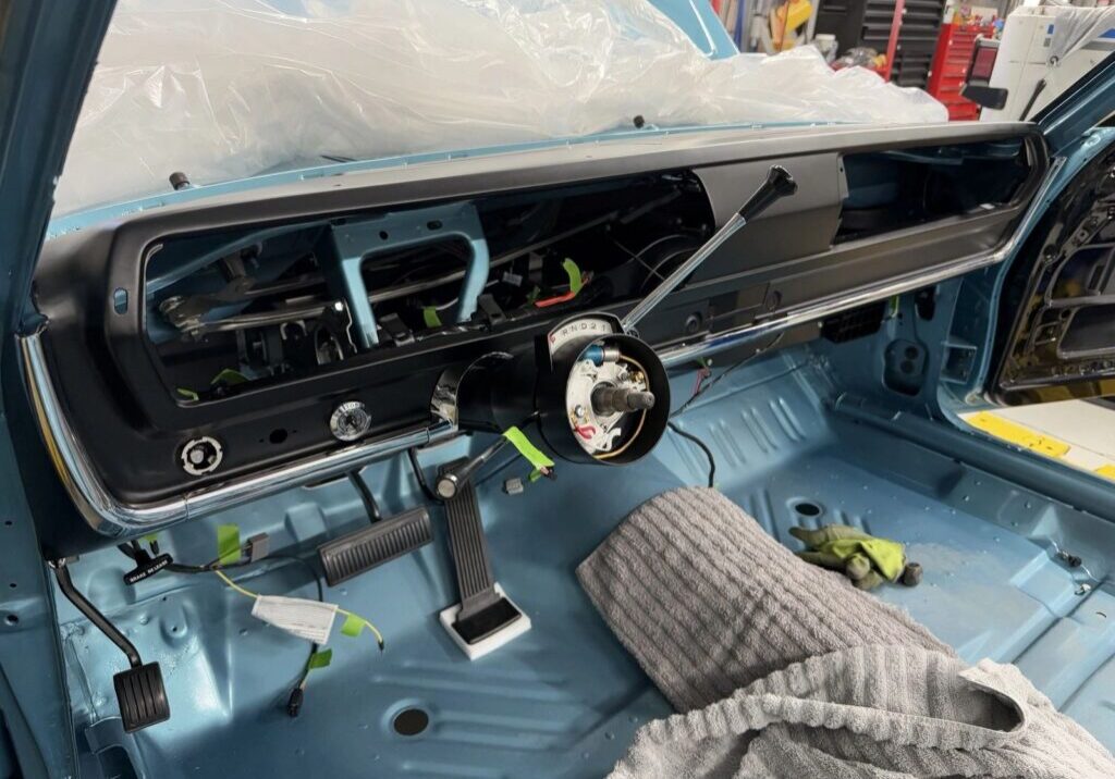 Vintage car dashboard under restoration process.