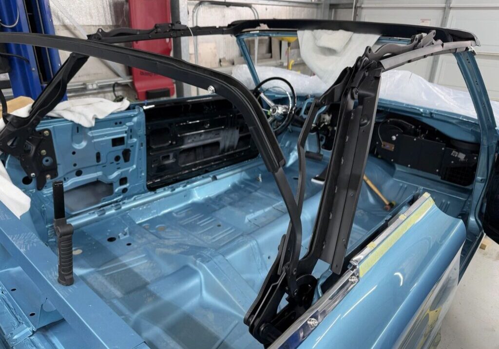 Blue convertible car interior under restoration.