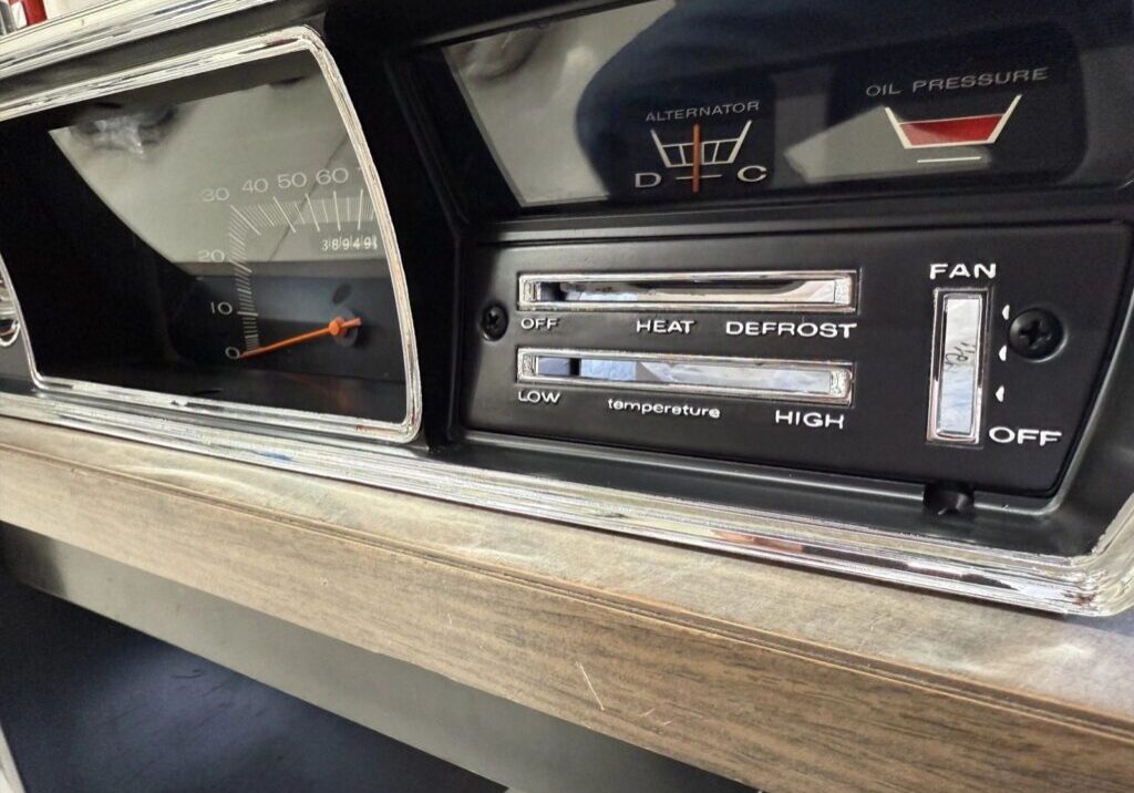 Vintage car dashboard with temperature controls.