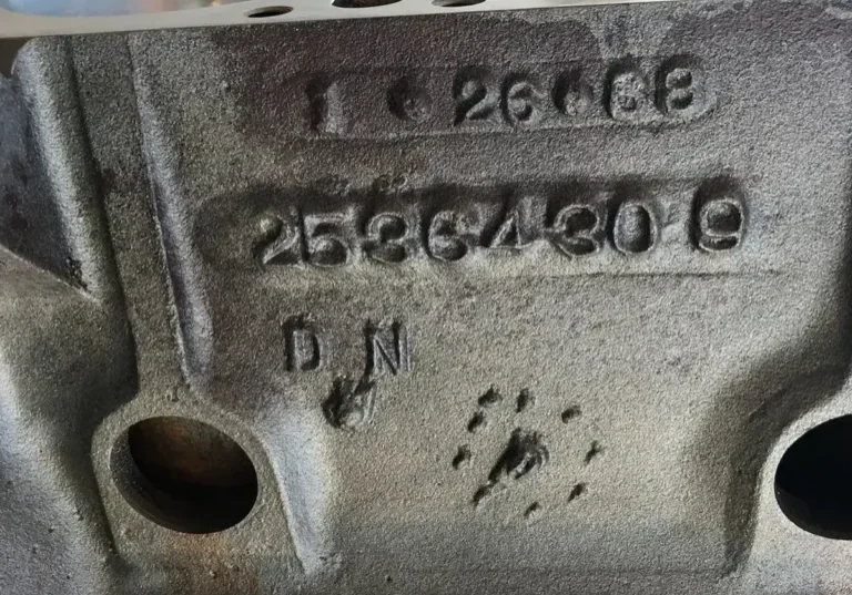 Close-up of stamped engine block numbers